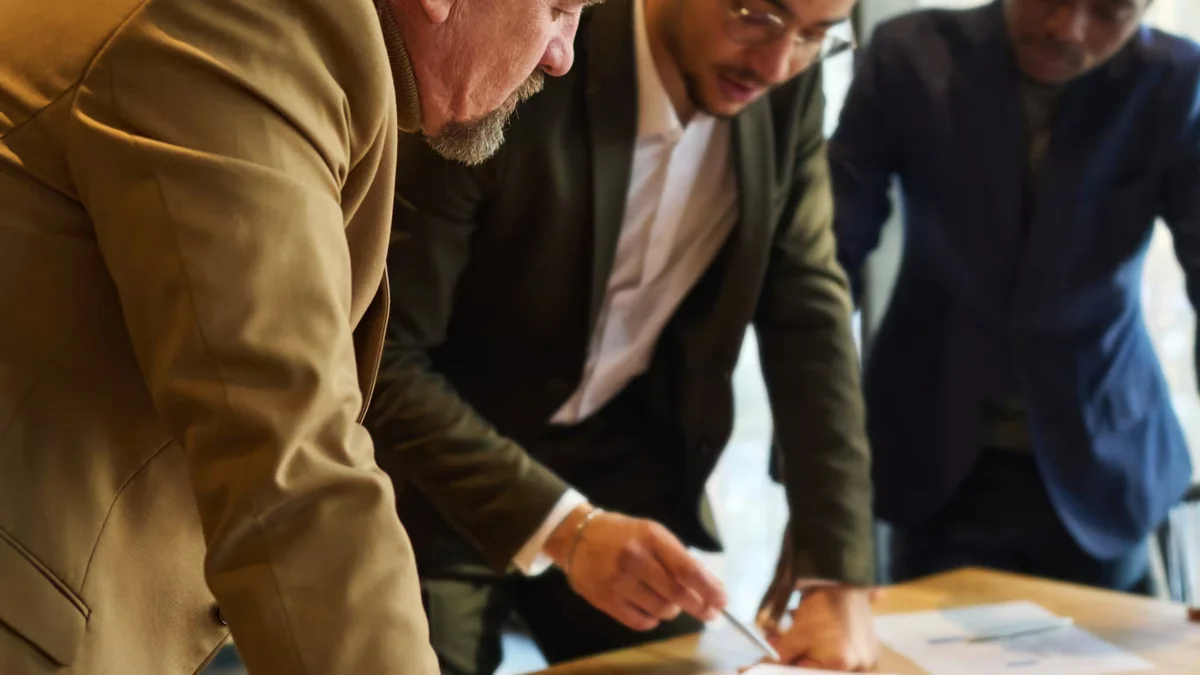 Supervisor and employee reviewing performance development goals together